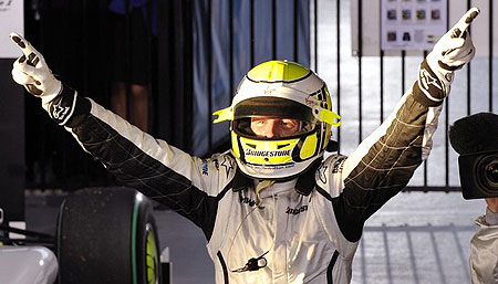 Brawn driver Jenson Button of Great Britain celebrates in pit lane after winning Formula One's Australian Grand Prix in Melbourne on March 29, 2009